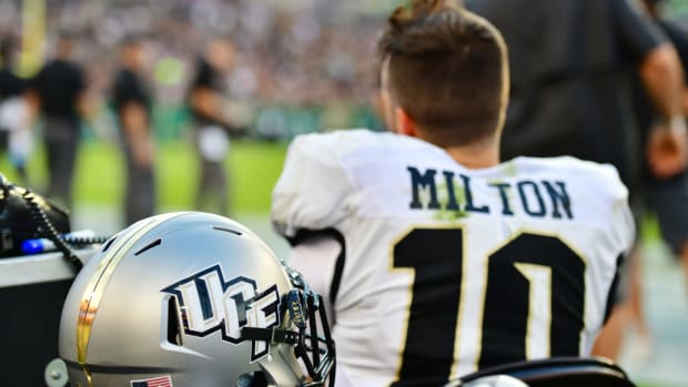 ucf star quarterback mckenzie milton looks onto the field