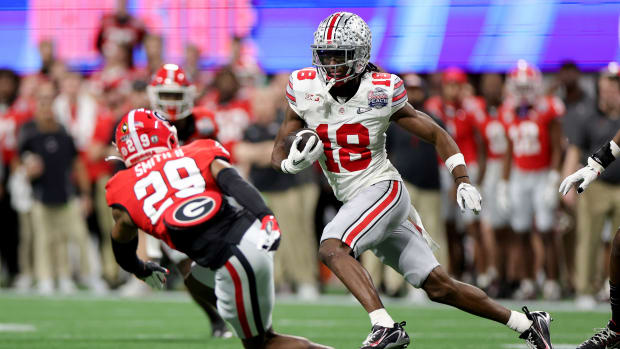 ATLANTA, GEORGIA - DECEMBER 31: Marvin Harrison Jr. #18 of the Ohio State Buckeyes runs after a catch during the second quarter against the Georgia Bulldogs in the Chick-fil-A Peach Bowl at Mercedes-Benz Stadium on December 31, 2022 in Atlanta, Georgia. (Photo by Carmen Mandato/Getty Images)