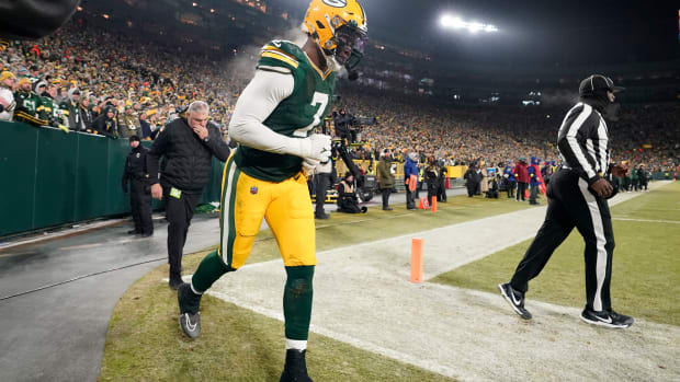 Packers rookie Quay Walker leaves the field on Sunday night.