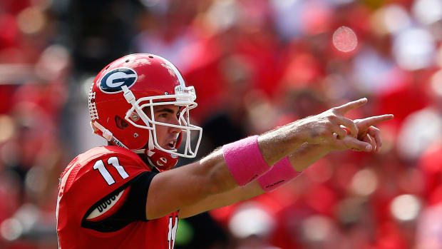 Aaron Murray points while playing quarterback in a game for Georgia.