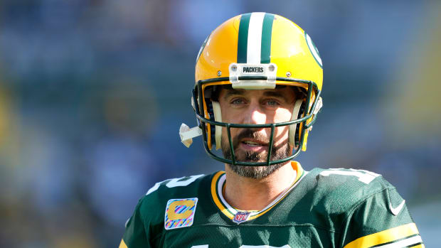 Packers quarterback Aaron Rodgers on the field against the Patriots.
