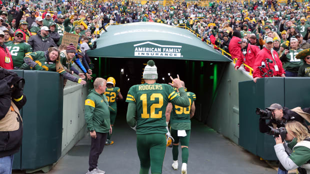 Aaron Rodgers leaves the field after Sunday's loss to the Jets.