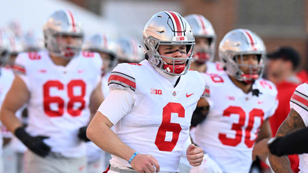 COLLEGE PARK, MARYLAND - NOVEMBER 19: Kyle McCord #6 of the Ohio State Buckeyes runs onto the field before the game against the Maryland Terrapins at SECU Stadium on November 19, 2022 in College Park, Maryland. (Photo by G Fiume/Getty Images)