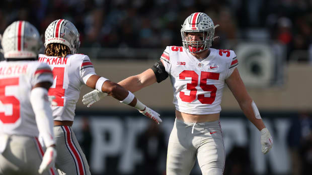 EAST LANSING, MICHIGAN - OCTOBER 08: Tommy Eichenberg #35 of the Ohio State Buckeyes celebrates a first half tackle while playing the Michigan State Spartans at Spartan Stadium on October 08, 2022 in East Lansing, Michigan. (Photo by Gregory Shamus/Getty Images)