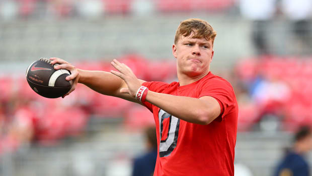 Ohio State quarterback Devin Brown throws the ball during warmups before a game.